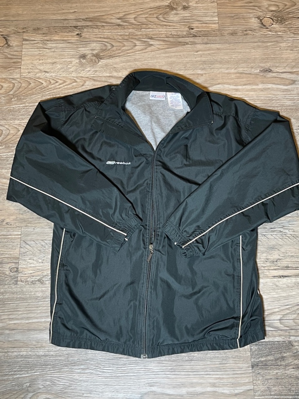 Vintage Reebok Men's Black Lightweight Track Jacket with Reflective Piping